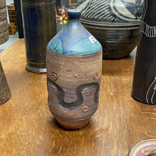 NZ Pottery Vase by Roger Brittain. Incised decoration with teal blue top. Signed. H25cm