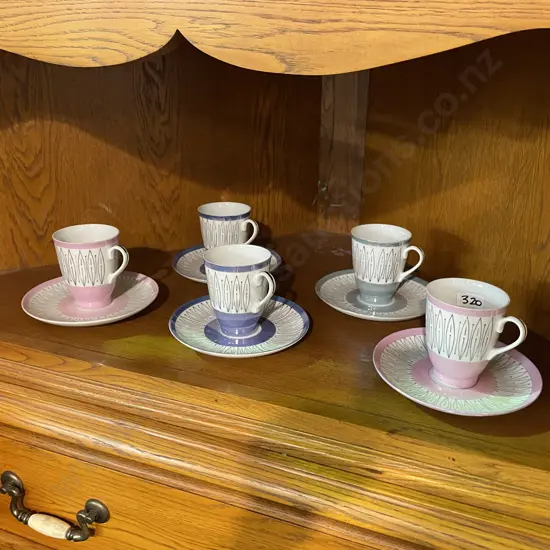 Set of 5 Mid Century Lustre ware cups and saucers. Various colours
