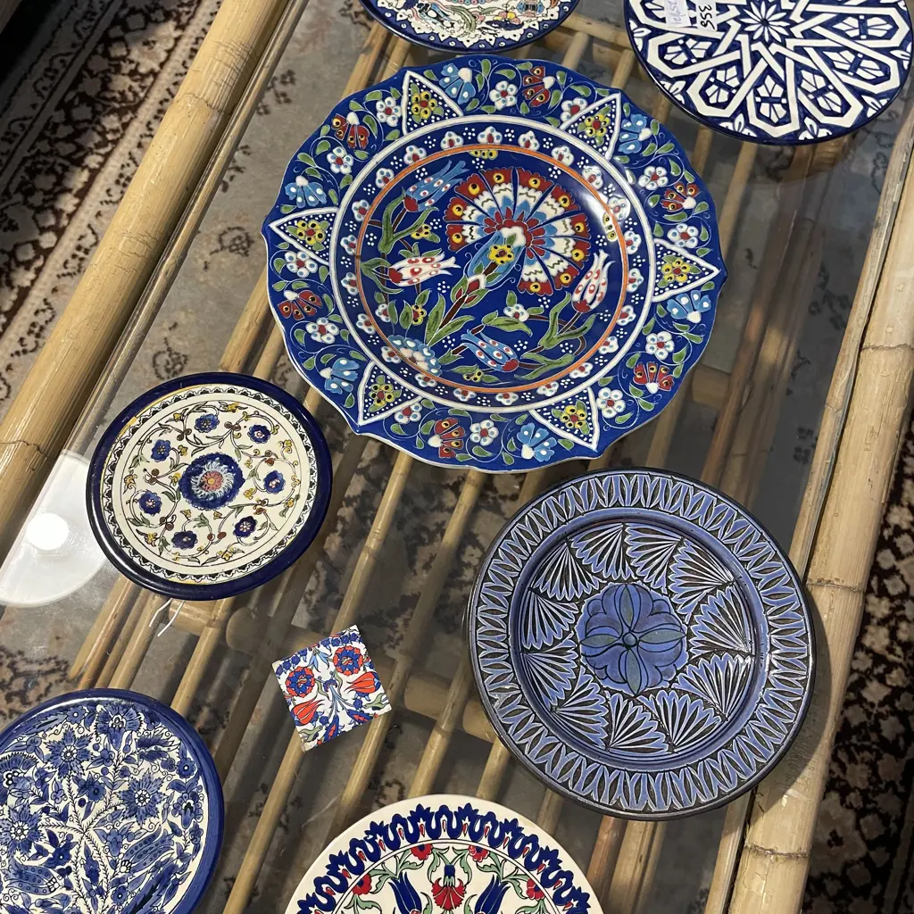 Selection of handpainted plates, some with enamelling. Various sizes Image 1++