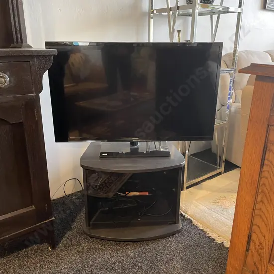 Panasonic TH-L39B6Z 39 inch TV with Sony Blu-Ray Disc Player on Glass Front TV Stand