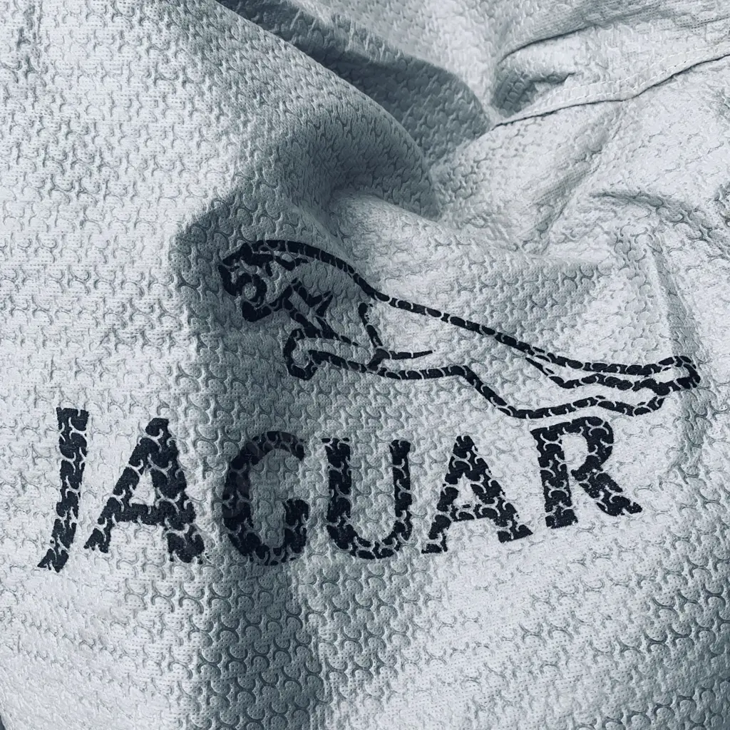 Grey Jaguar Car Cover (possibly indoor) with one other large size car cover (possibly rain protector) Image 1++