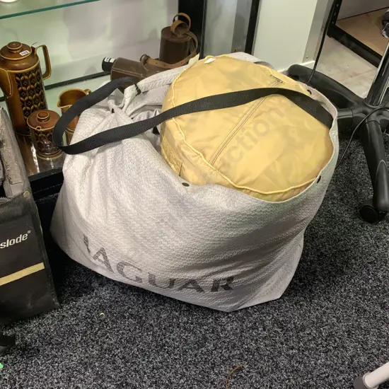 Grey Jaguar Car Cover (possibly indoor) with one other large size car cover (possibly rain protector)