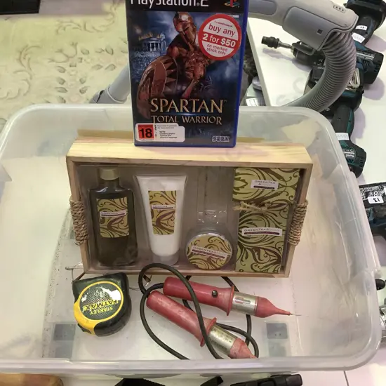 Plastic Container Containing Green Tea Gift Pack, Playstation Game Fatmax Tape Measure Etc.