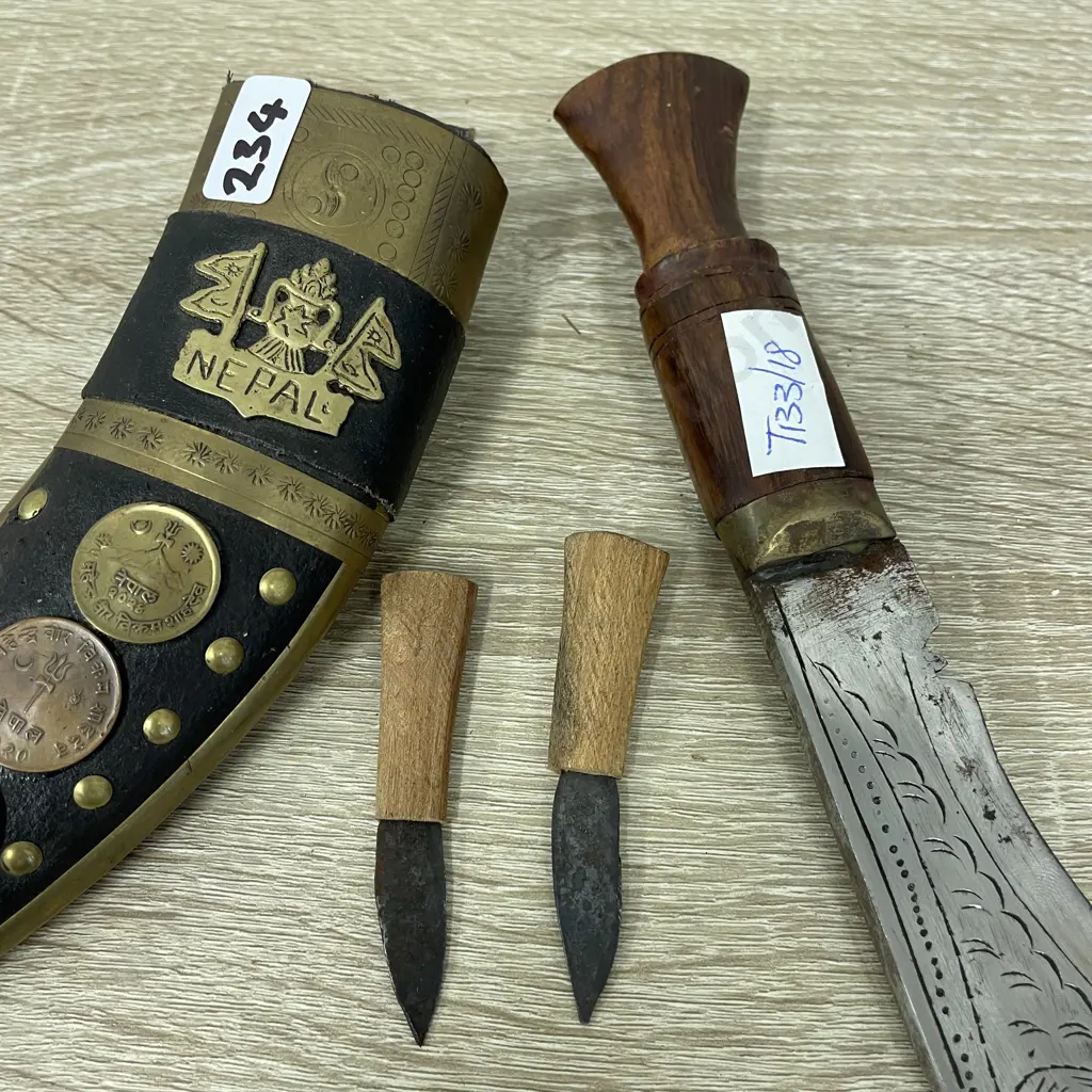 Knife and Scabbard with two miniature knives. Nepal. Ornately detailed with coins and brass. Etched blade Image 1++