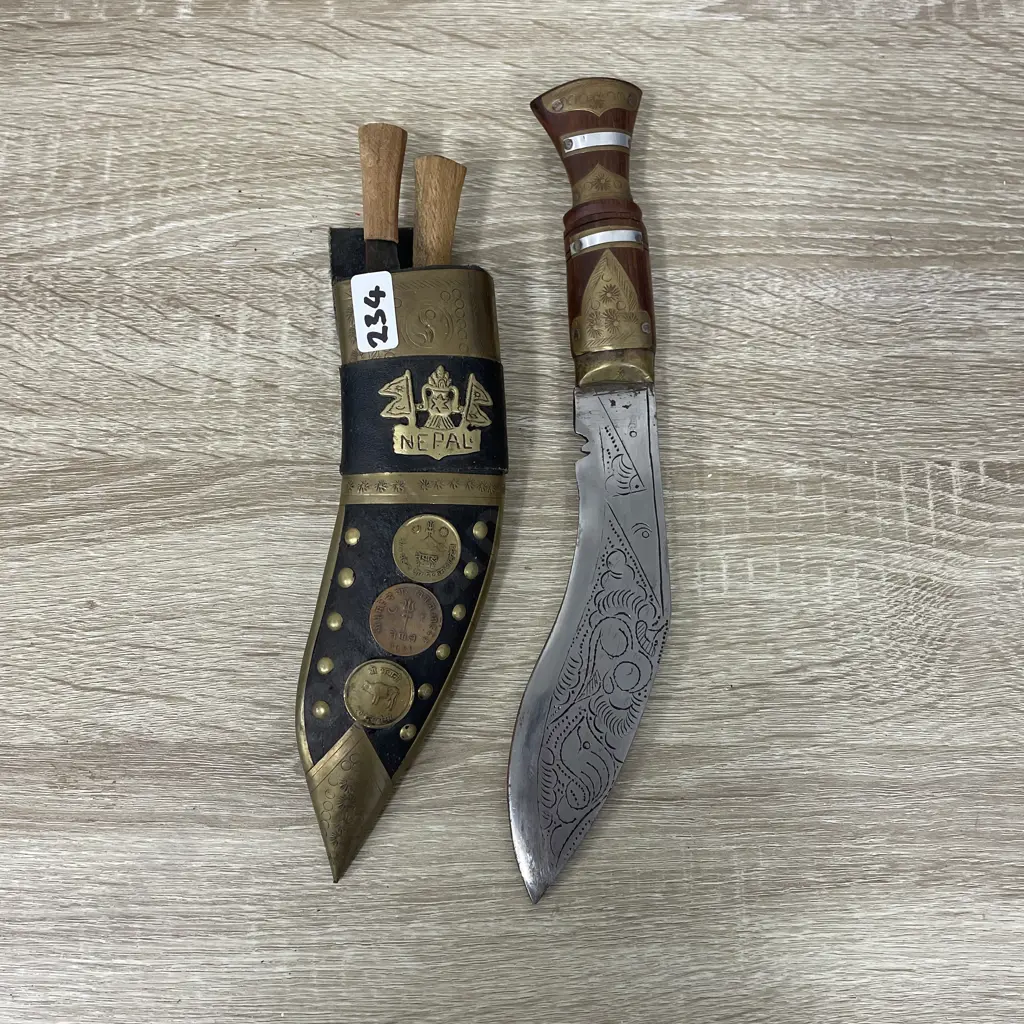 Knife and Scabbard with two miniature knives. Nepal. Ornately detailed with coins and brass. Etched blade Image 1++
