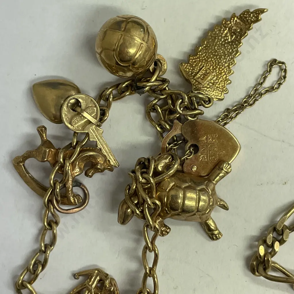 9ct gold heart lock bracelet with some hallmarked gold charms and hallmarked fob bracelet Image 1++