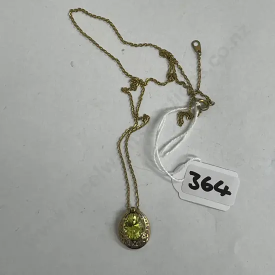 Hallmarked (10ct) Gold and Peridot Pendant with SN gold chain