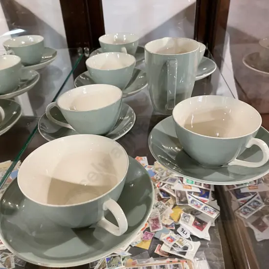 Poole Teaset items. 4 x cups and saucers, 2 breakfast cups and saucers with jug